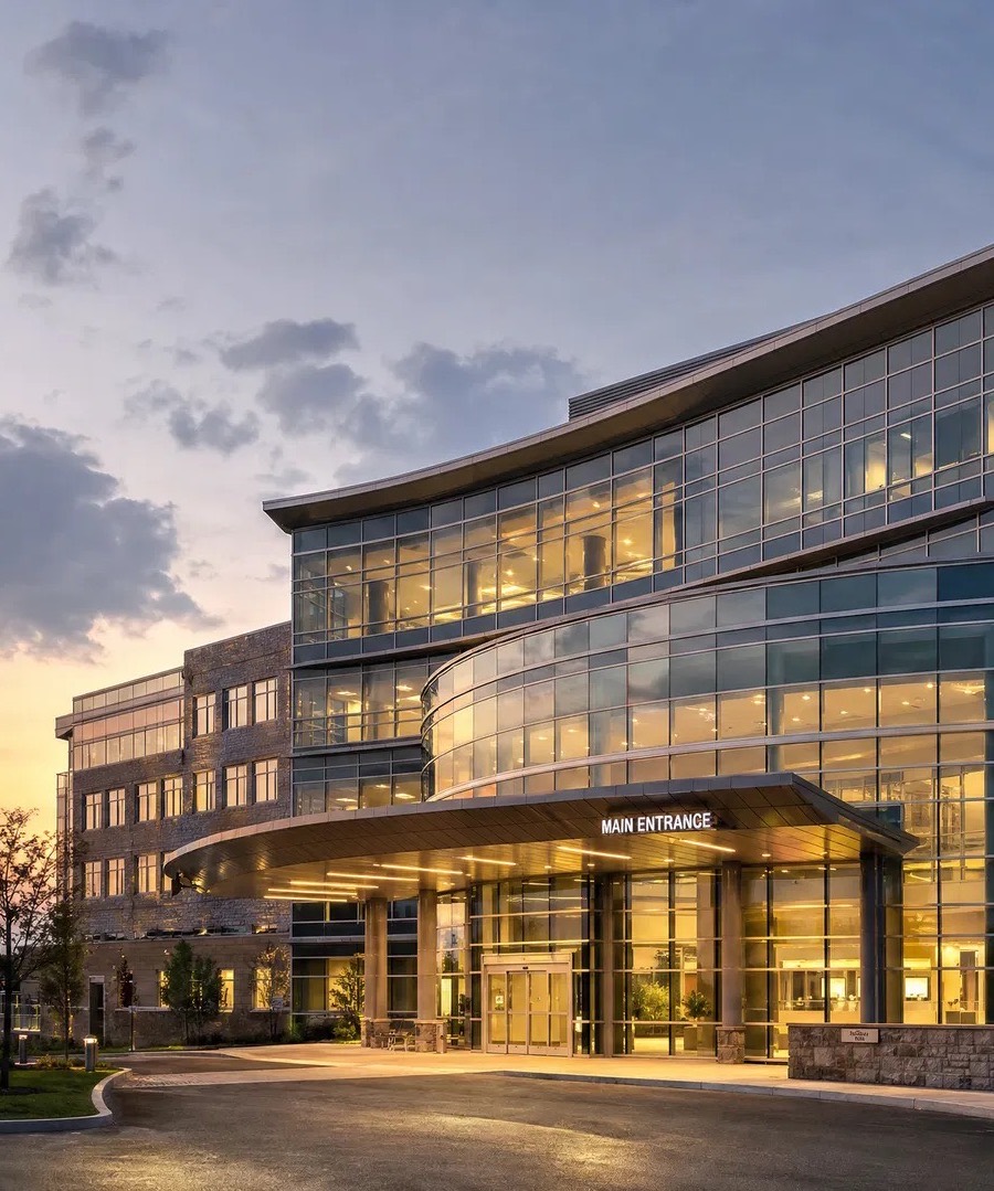 Exterior of a modern hospital building at dusk